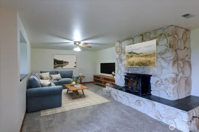 Another living space with wood stove insert offers even more room or could be a 2nd primary bedroom. There is a slider for access to the lower deck area and pool. * Room is virtually staged