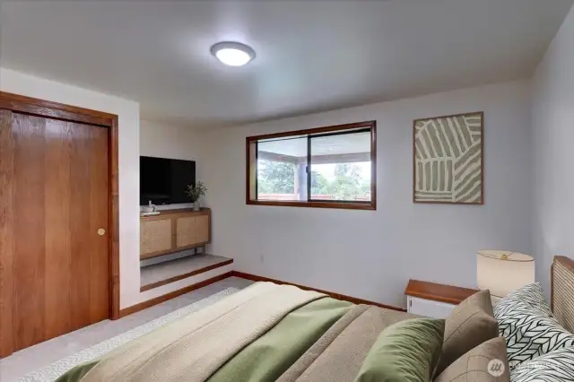 The lower level bedroom offers 2 closets & beautiful wood trim. *Room is virtually staged
