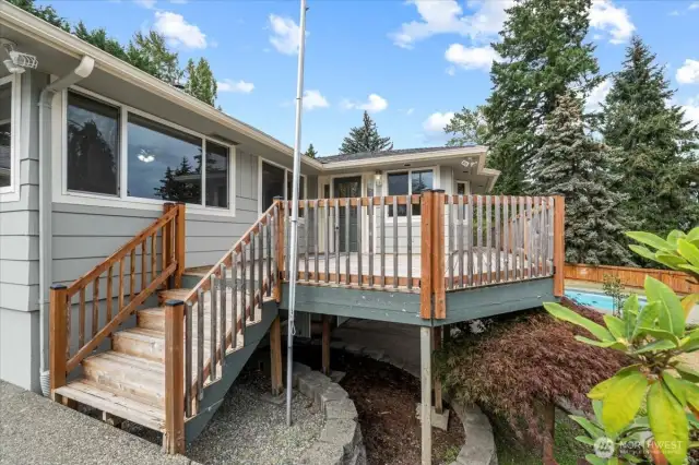 The front entry overlooks the lush, established landscaping