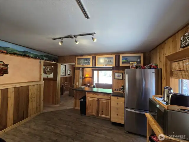 More custom woodwork and murals in the kitchen.