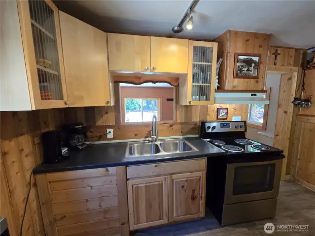 The kitchen has a nice view of the front yard through the entry room.