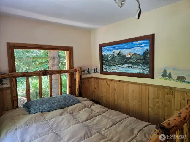 Hand painted murals along the wall in the 2nd bedroom.