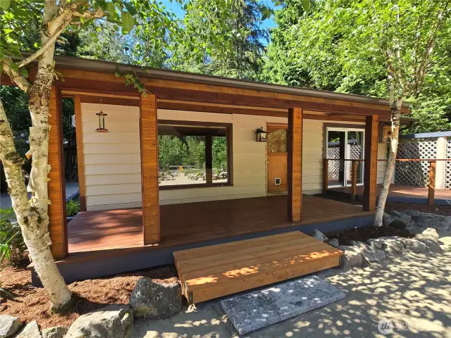 Great covered view-side porch for year-round enjoyment of river and mountain views, even on rainy Washington days.