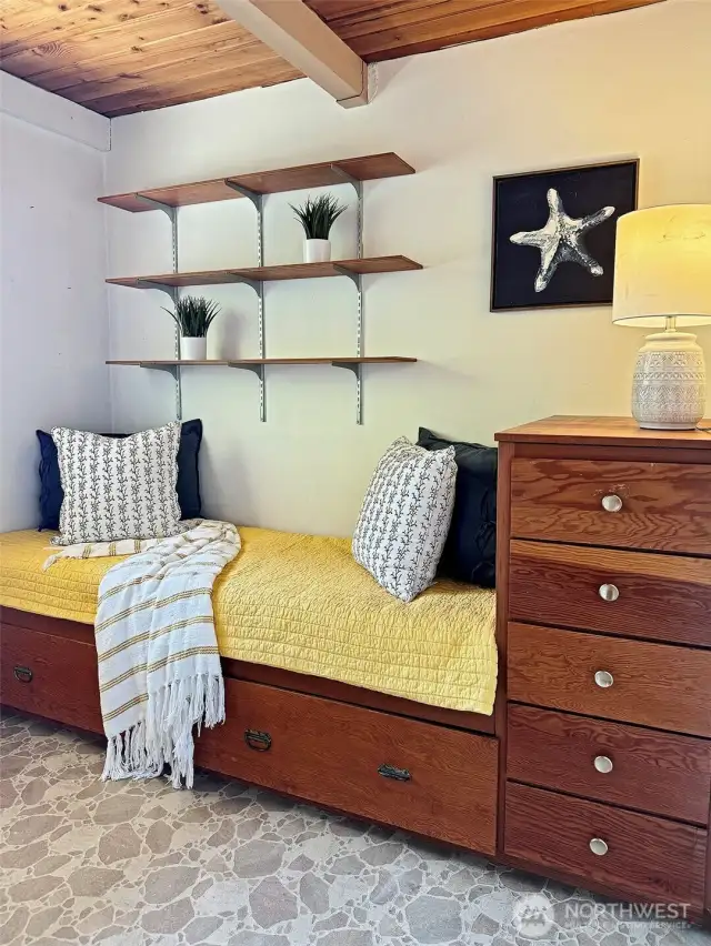 Second bedroom with built-in twin bed and dresser.