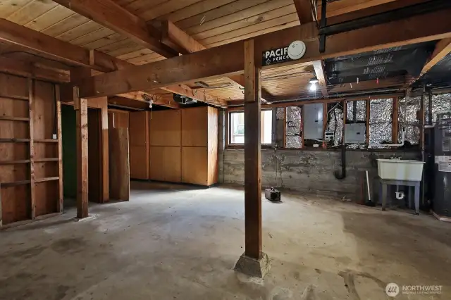 Here's the unfinished basement. There's a bathroom with a stall shower. Perfect opportunity to create more living space.