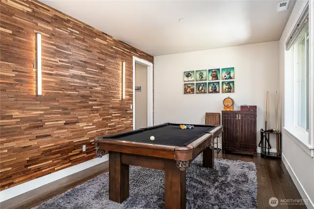 Formal dining room or front sitting area currently being used for a pool table.