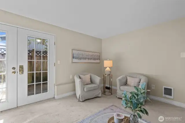 French doors to fully fenced backyard