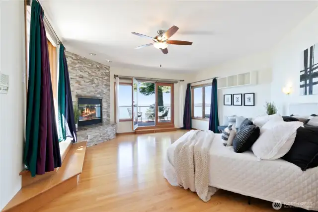 Primary Suite with fireplace & automatic blinds