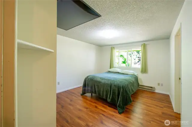 Primary bedroom with adjoining full bathroom.