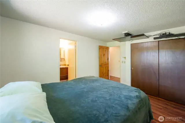 Primary bedroom with adjoining full bathroom.