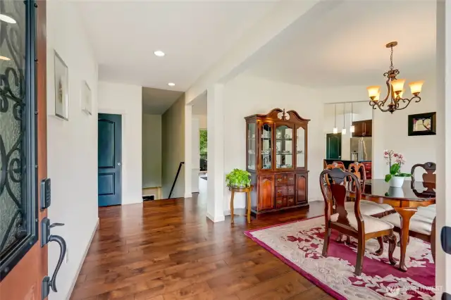 Step inside to soaring ceilings, rich designer touches, and a light-filled open floorplan.