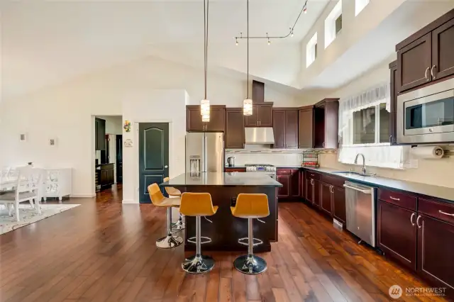 Entertain with ease in the expansive formal dining room, bathed in natural light and perfectly suited for both intimate dinners and large gatherings.