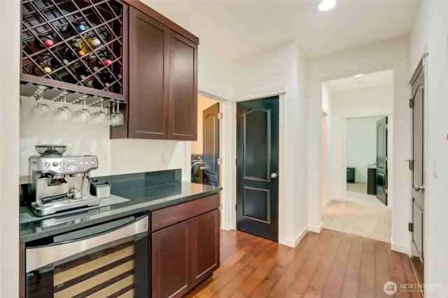 Butler's pantry with wine rack and beverage cooler.