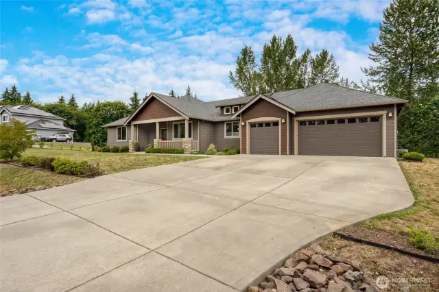 With its spacious three-car garage, abundant storage, and a setting that perfectly balances privacy with community, this remarkable home embodies the best of refined Northwest living.