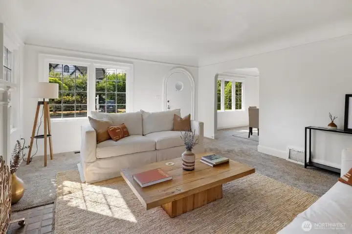 Original hardwood floors throughout the main level under the carpeting.