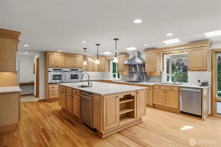 Abundant Natural Light Pours into the Kitchen Through Skylights and Garden Window