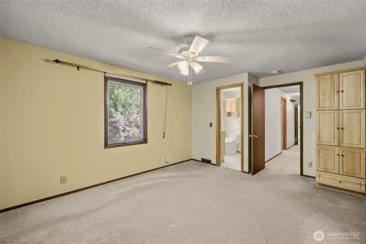 Spacious Primary Bedroom with Ceiling Fan and Attached Bathroom