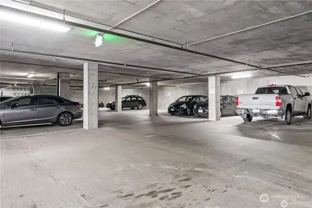 2 designated parking spaces (#76,77) + private storage in garage.