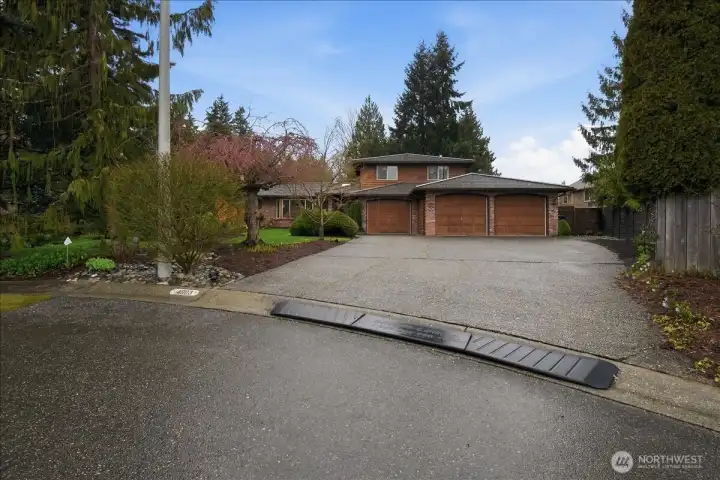 Generous off-street parking, oversized driveway, and spacious 3-car garage set on a quiet cul-de-sac.