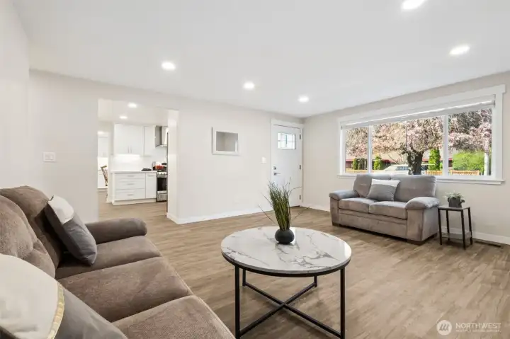 Living Room facing Kitchen and Front Door