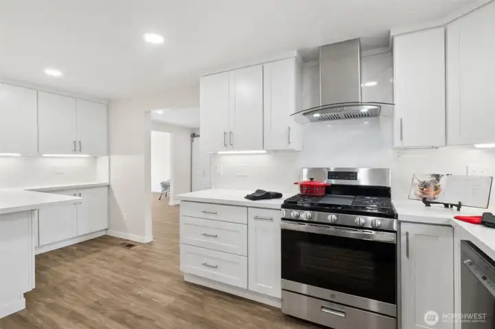 Kitchen facing Dining Room.  Gas Stove and Vent Vent.