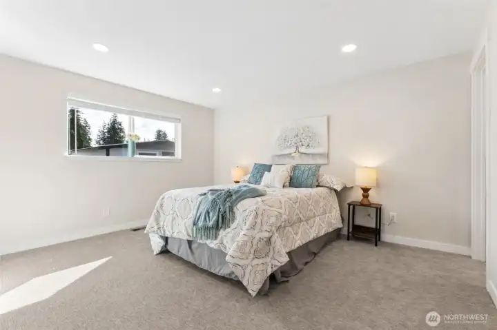 Main Floor Primary Bedroom with Private 3/4 Bathroom.