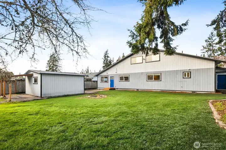 Back Yard view of Home (Grass is sprouting now - this is edited grass)