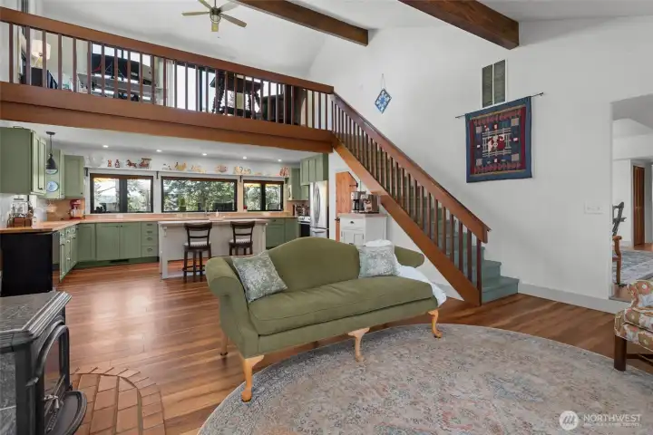 Custom stairway leads to the loft and upper deck where the views of Penn Cove are stunning!
