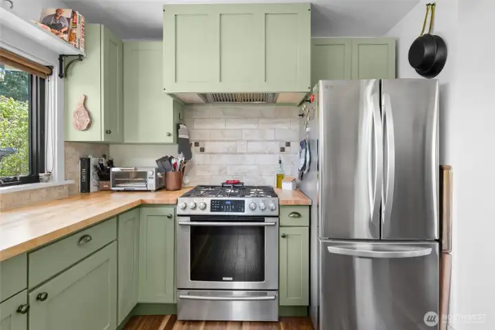Stainless steel appliances and gas range.