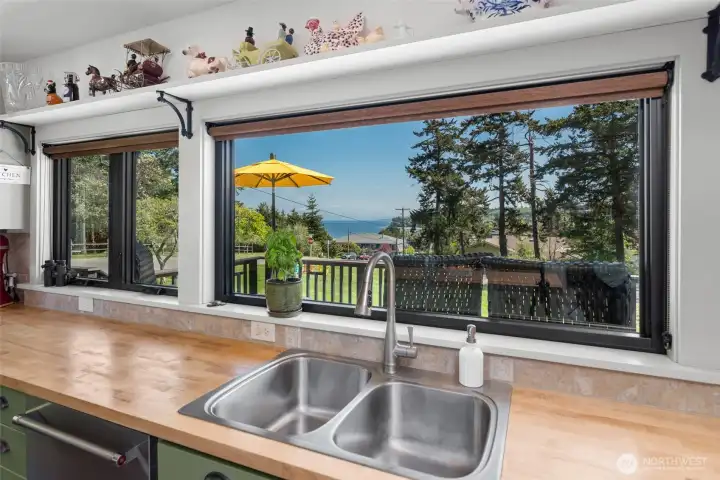Panoramic views from the kitchen! Expansive sea and sky to brighten all your culinary endeavors.