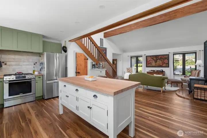 Large custom island adding further workspace and breakfast bar.