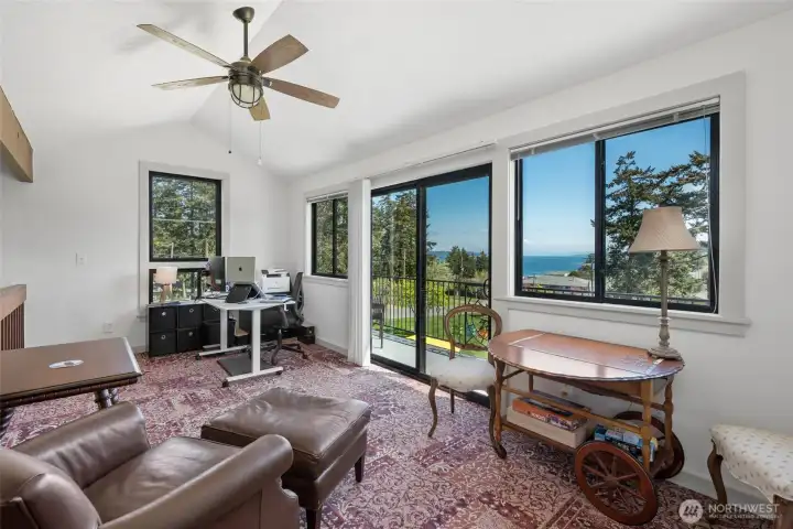Charming loft area, currently used as office. Vaulted ceilings and the large windows and slider to the upper deck allow you to enjoy the serenity of this location year round!