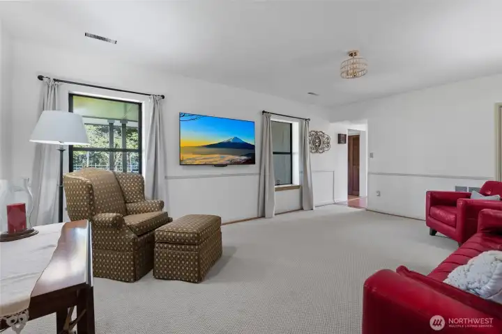 Spacious family room. This home has efficient heat pump furnaces for both heat and A/C.