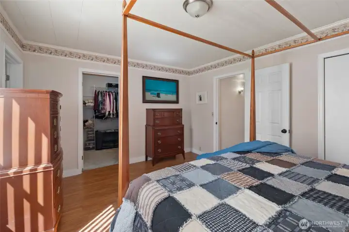 Primary bedroom with a large walk in closet