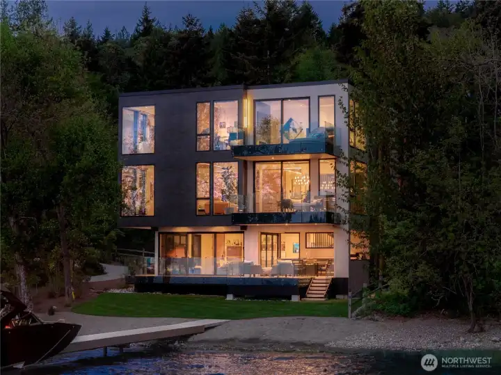 Completed in 2023 by McCullough Architects on 122’ of sun-drenched East Lake Sammamish waterfront, with an expansive shoreline, private dock, and adjacent unbuildable lot preserving long-term privacy.