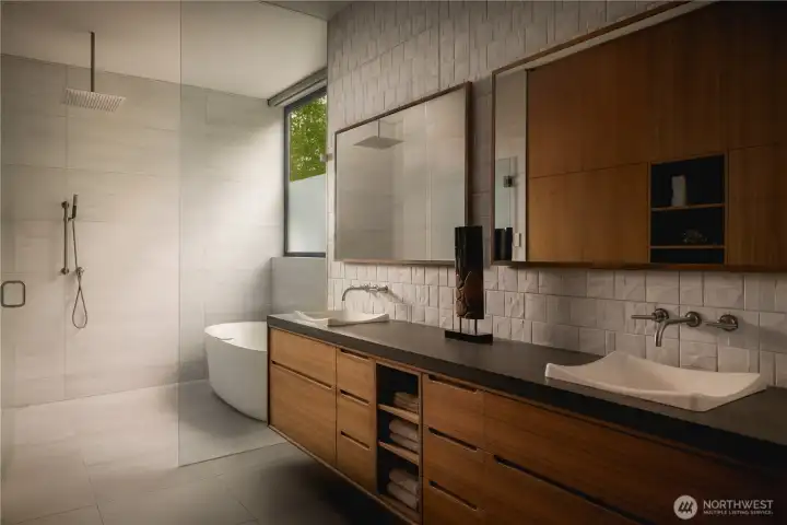 A wet room layout brings tub and shower into a single, continuous space, layered with warm walnut and texture.