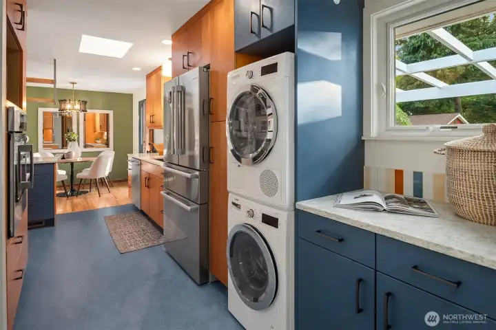 integrated laundry area with handy folding area. integrated laundry area with handy folding area.