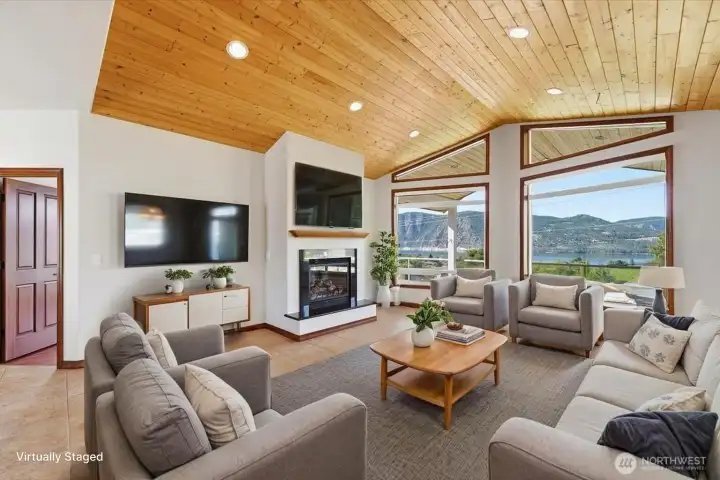 Open-concept living area designed to maximize views, comfort, and entertaining opportunities. (Virtually Staged) Open-concept living area designed to maximize views, comfort, and entertaining opportunities. (Virtually Staged)