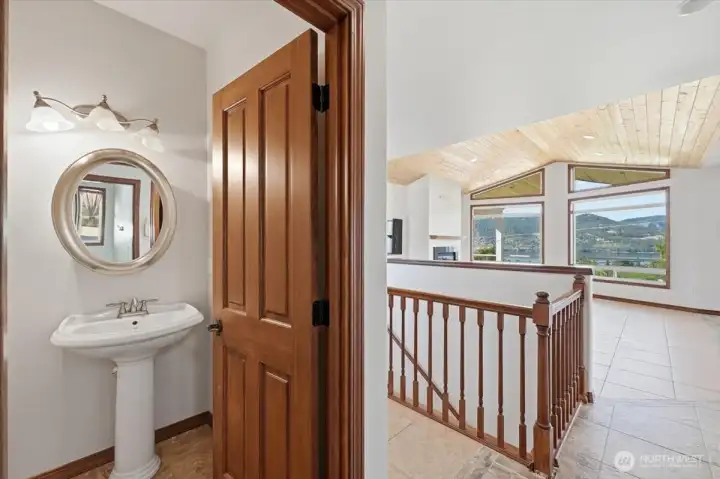 Powder room located just off the kitchen and great room enhances functionality for daily living and hosting. Powder room located just off the kitchen and great room enhances functionality for daily living and hosting.
