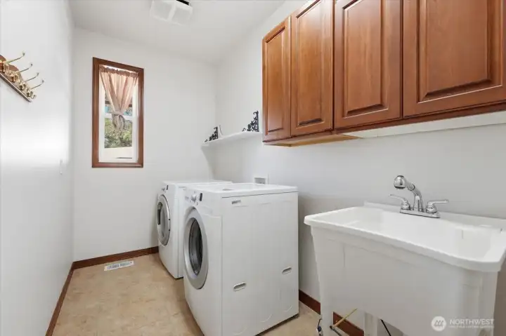 Convenient main-floor utility room supports true single-level living functionality. Convenient main-floor utility room supports true single-level living functionality.