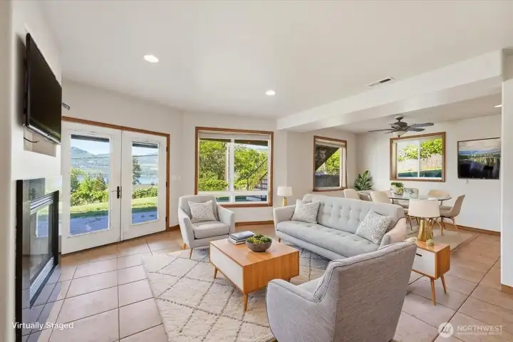 Bright and spacious secondary living room featuring abundant windows and continued Lake Chelan views. (Virtually Staged) Bright and spacious secondary living room featuring abundant windows and continued Lake Chelan views. (Virtually Staged)