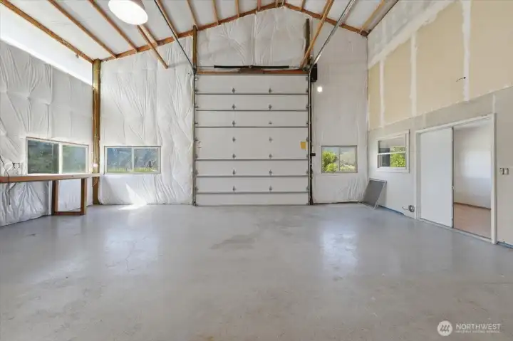 Oversized shop designed to accommodate boats, RVs, vehicles, equipment, and recreational toys. Oversized shop designed to accommodate boats, RVs, vehicles, equipment, and recreational toys.