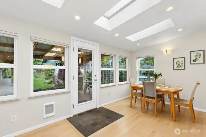 The light filled sunroom/dining nook area