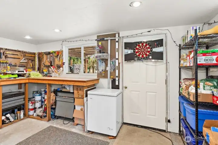 Storage areas and workshop area adjacent to back carport