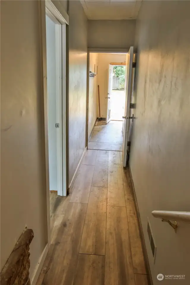 Hallway to back yard and with privacy for rec room.