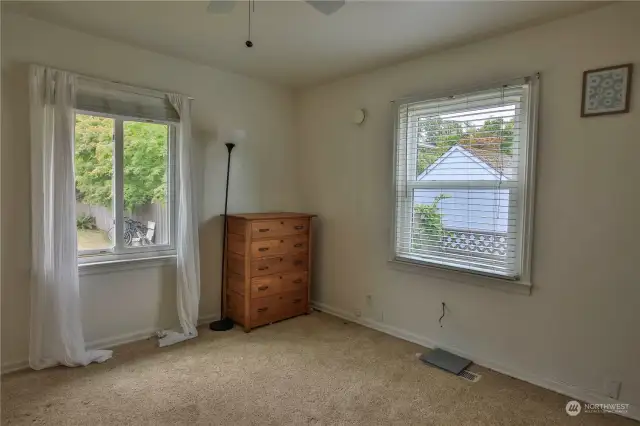 Primary bedroom facing back yard with en-suite bathroom.