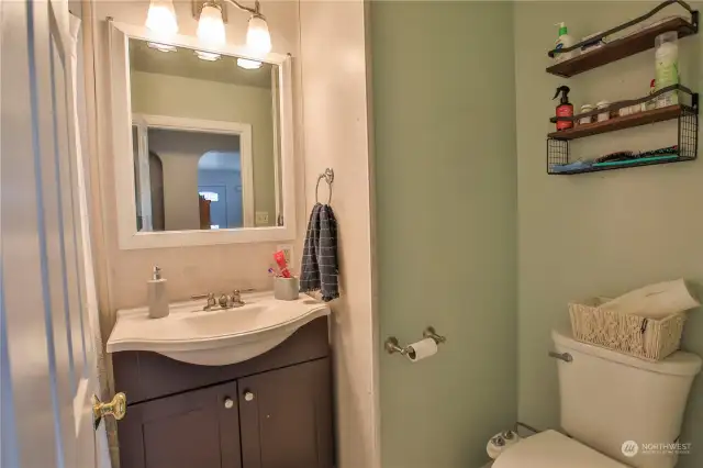 Hallway bathroom with full tub.