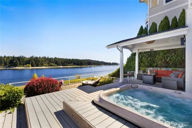 Imagine yourself soaking up the sun on the expansive two-tiered deck with hot tub and covered outdoor seating. You can feel the ocean breeze and hear the waves from the shore.