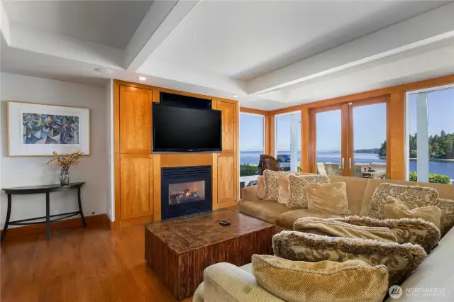Puget Sound and Cascade Mountain views from the expansive, light-filled, living room with gas fireplace