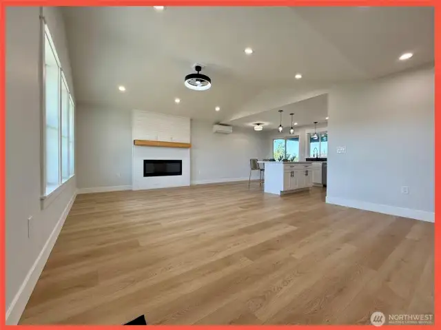 Bright and airy great room with vaulted ceilings and fireplace with wood mantle for those PNW chilly evenings.